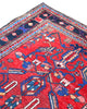 Tappeto Hamedan 200x130 cm persiano, rettangolare, annodato a mano, fondo rosso con motivi geometrici e floreali blu e avorio, bordi decorati.
