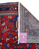 Tappeto Hamedan 200x130 cm persiano, rettangolare, annodato a mano, fondo rosso con motivi geometrici e floreali blu e avorio, bordi decorati.