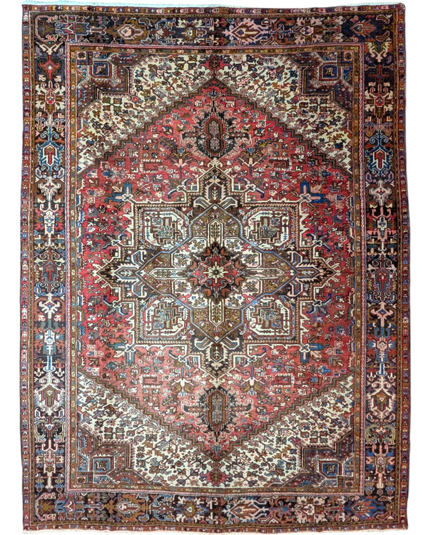 Tappeto Heriz persiano 347x255 cm, annodato a mano in lana e cotone, con medaglione geometrico e motivi floreali tradizionali.