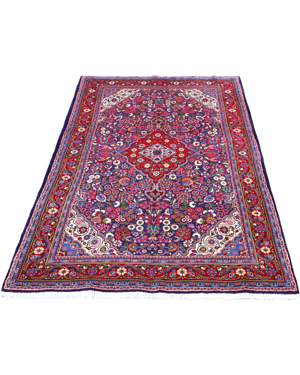 Tappeto Jozan 203x131 cm persiano, annodato a mano, fondo blu e rosso con medaglione centrale e motivi floreali ricchi di dettagli.
