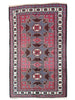 Tappeto Kazak 181x113 cm con motivo geometrico a stelle in rosso, blu e beige, annodato a mano con lana pregiata e ordito in cotone robusto.
