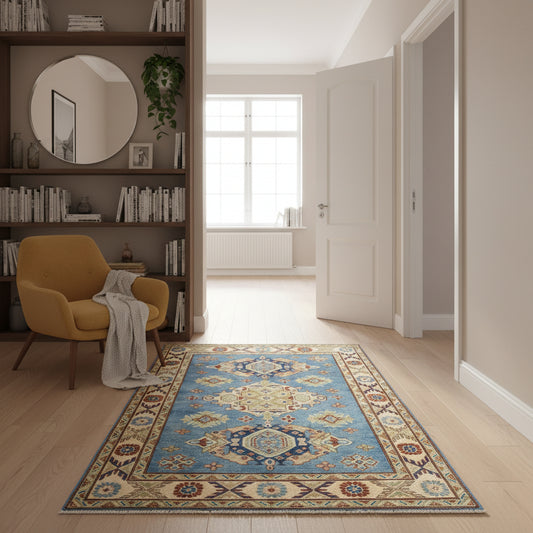 Tappeto Kazak celeste con cornice beige e motivi geometrici, annodato a mano in Afghanistan in lana e cotone con colori vegetali.