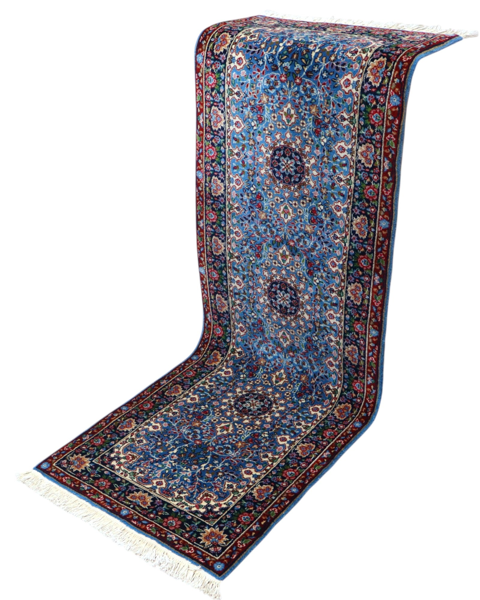 Tappeto Kerman 186x62 cm annodato a mano con fondo azzurro e cornice scura.