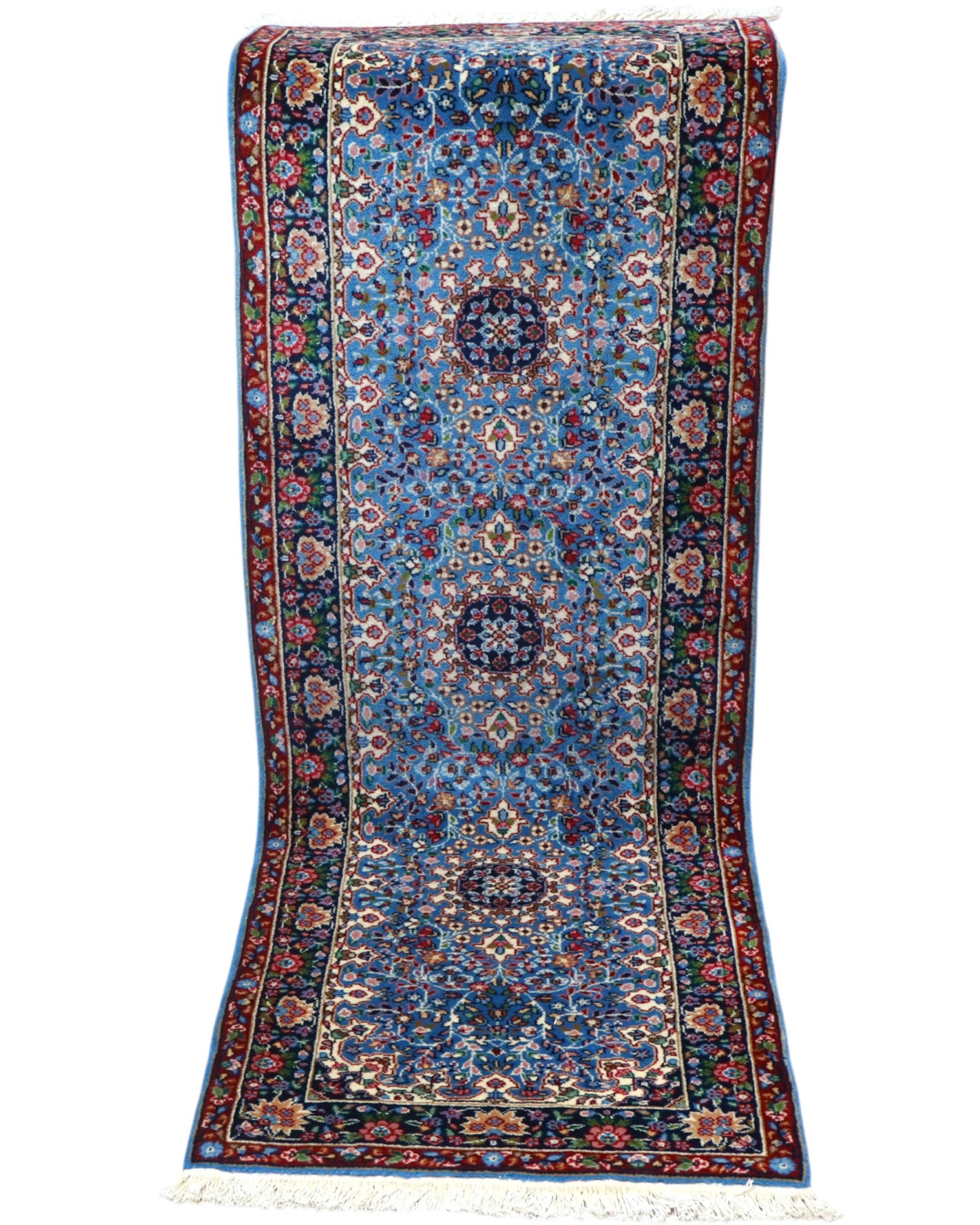 Tappeto Kerman 186x62 cm annodato a mano con fondo azzurro e cornice scura.