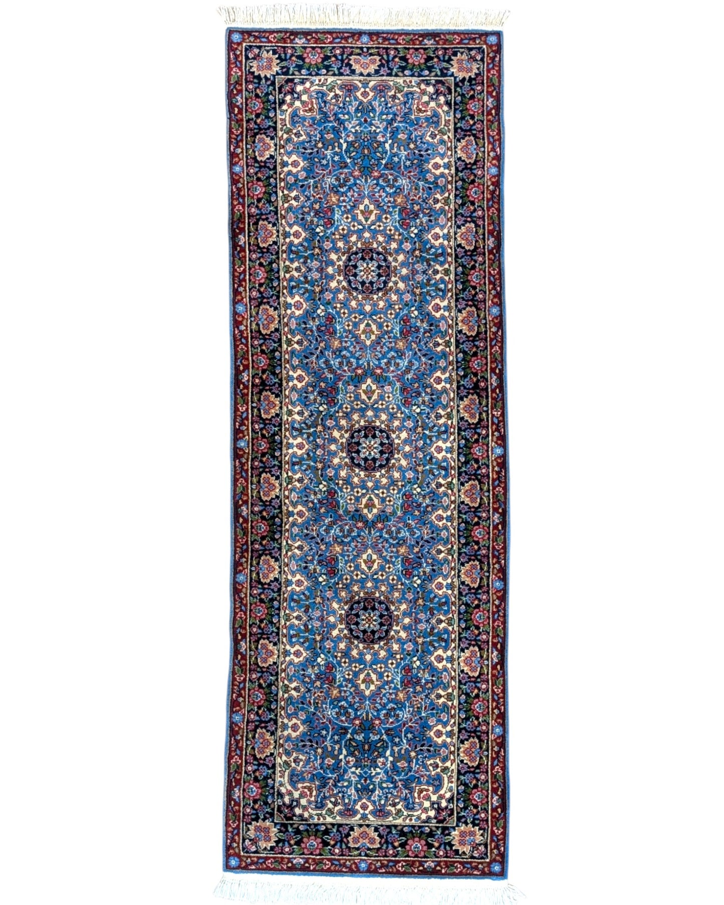 Tappeto Kerman 186x62 cm annodato a mano con fondo azzurro e cornice scura.