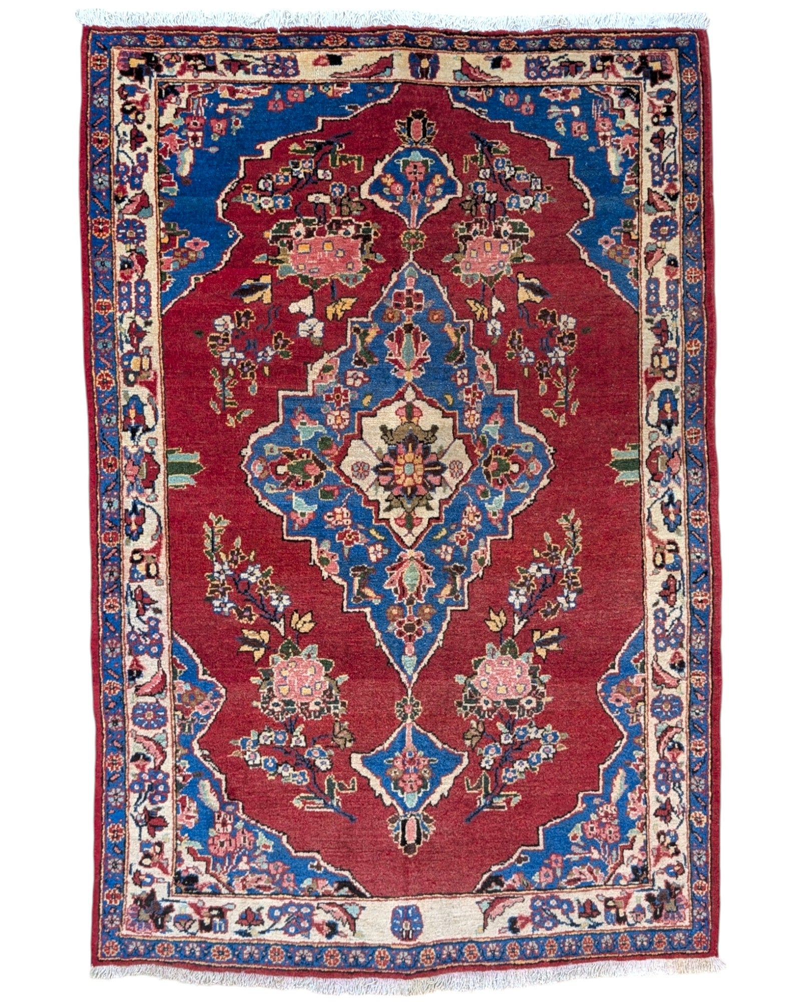 Tappeto Lilian rosso con cornice beige e motivi geometrici, annodato a mano in lana e cotone con colori vegetali.