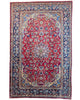 Tappeto Najafabad persiano 350x231 cm, annodato a mano in lana e cotone con colori vegetali, fondo rosso e dettagli blu e avorio.