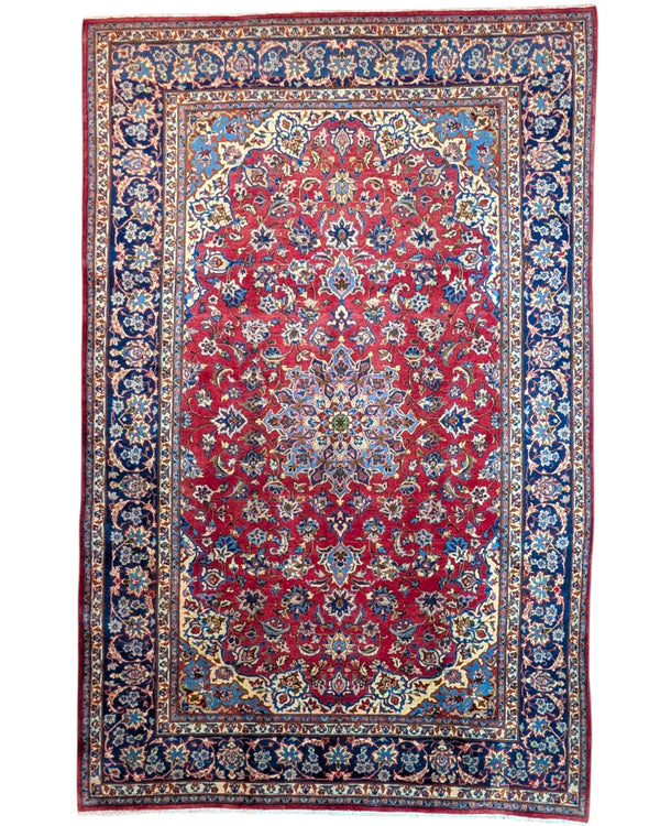 Tappeto Najafabad persiano 350x231 cm, annodato a mano in lana e cotone con colori vegetali, fondo rosso e dettagli blu e avorio.