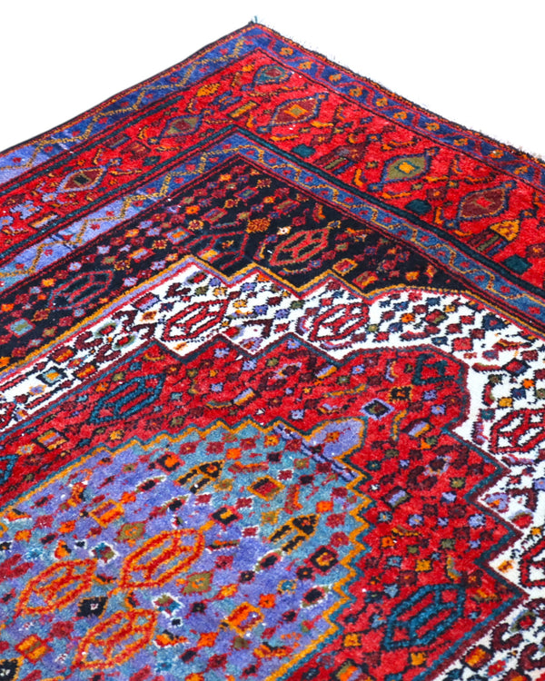 Tappeto Senneh 168x143 cm persiano, annodato a mano, medaglione centrale geometrico su fondo rosso con dettagli blu, avorio e arancio, tipico del Kurdistan iraniano.