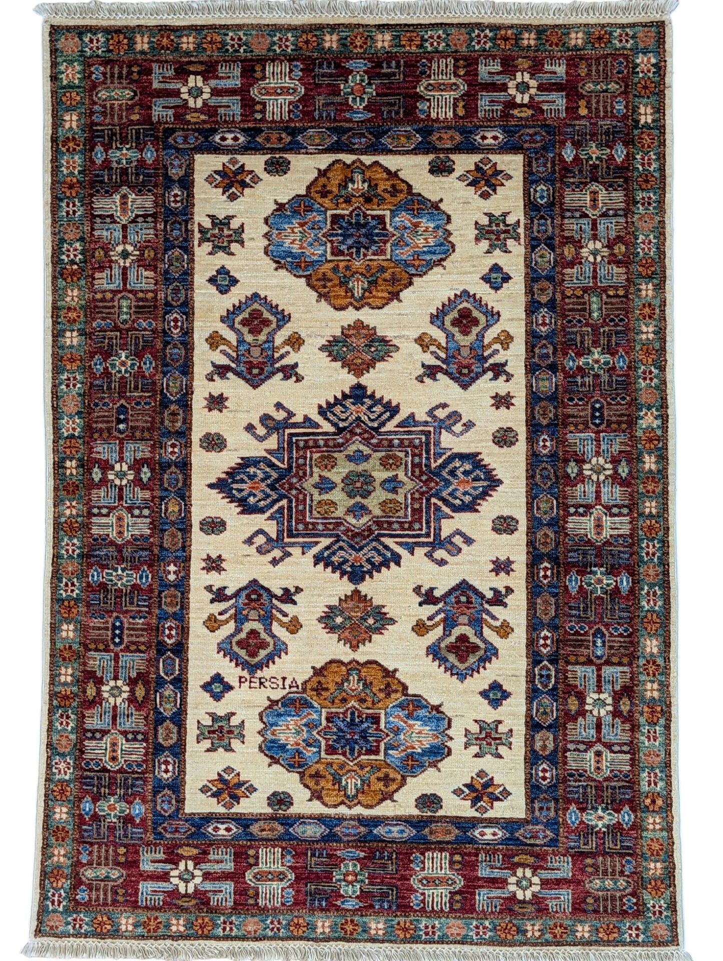 Tappeto Shirvan 145x100 cm, annodato a mano, lana pregiata con motivi geometrici e floreali caucasici.