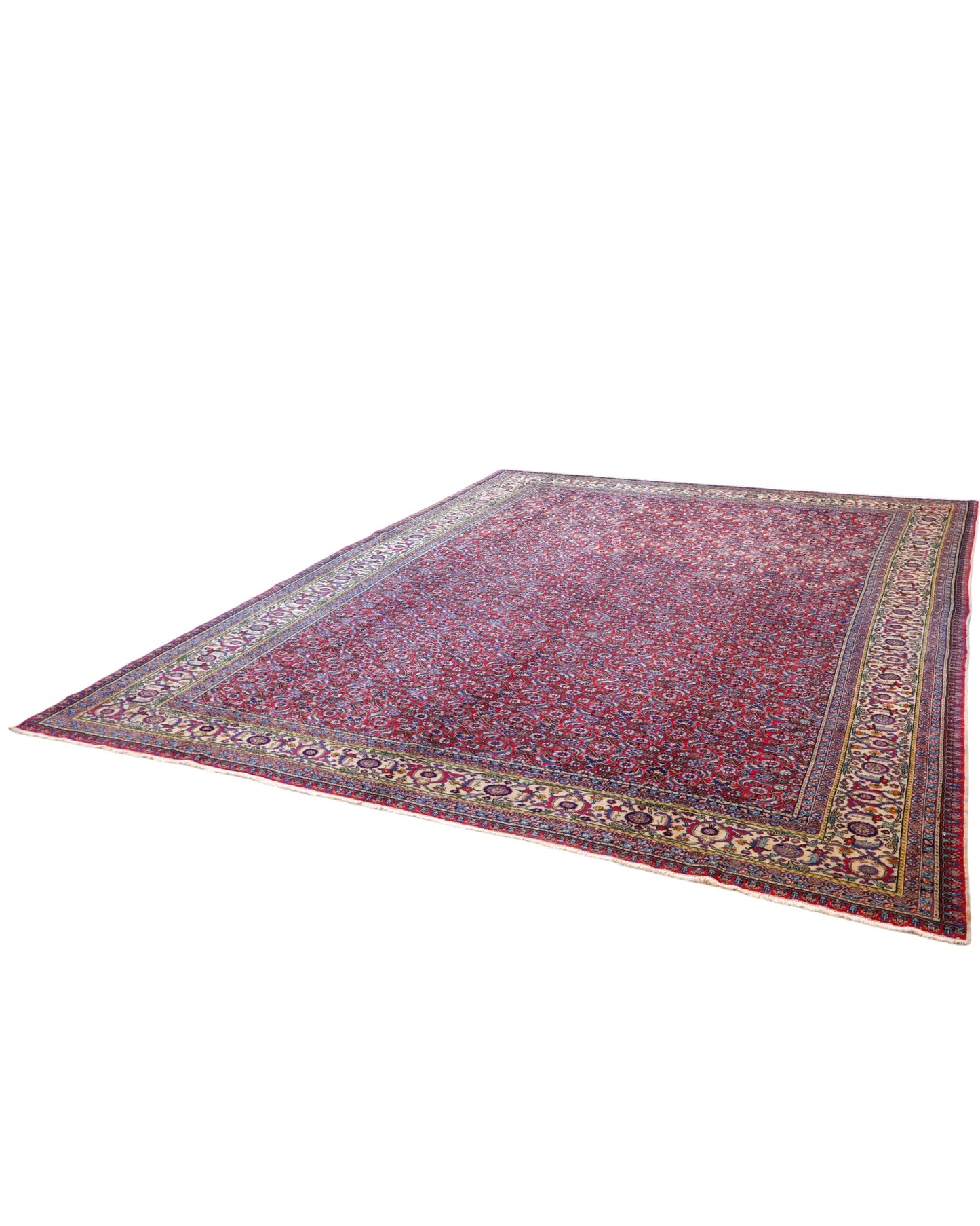 Tappeto Ushak 424x320 cm, fondo rosso con motivi ripetuti geometrici e floreali, cornice giallo-avorio, annodato a mano in lana vegetale, Turchia.