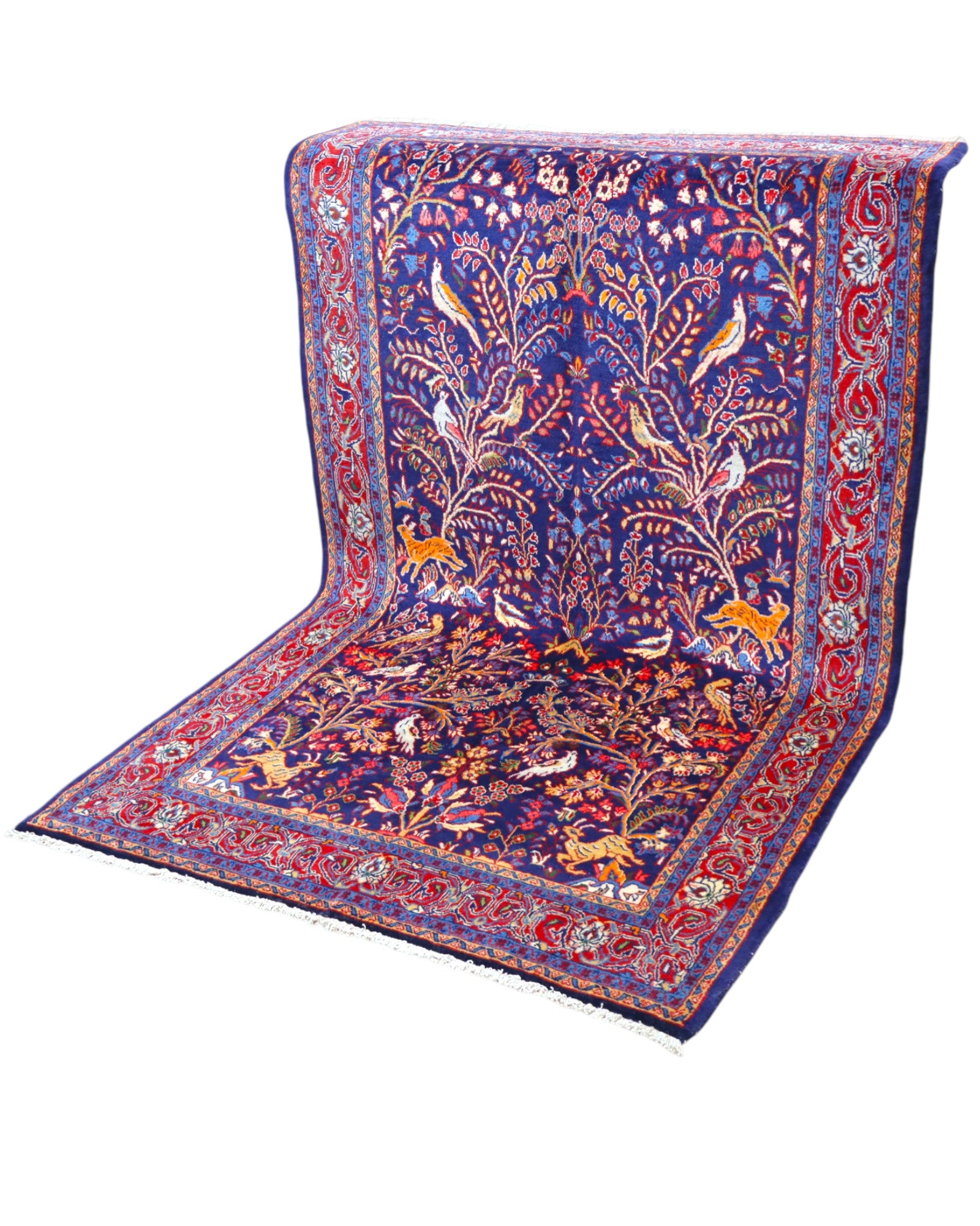 Tappeto Arak 210x126 cm persiano annodato a mano, con motivi floreali e animali su fondo blu intenso e cornice rossa decorata.