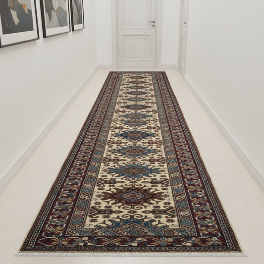 Tappeto Shirvan annodato a mano 301x83 cm in lana con fondo beige, cornice rossa e motivi geometrici tradizionali afgani.