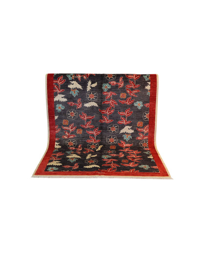 Tappeto moderno Persia 196x147 cm, fondo blu con fiori rossi e azzurri, bordo rosso, annodato a mano.