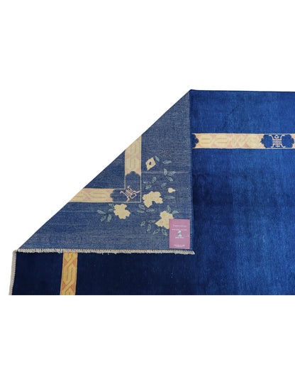 Tappeto moderno 284x213 cm Persia con fondo blu e cornice gialla decorata da fiori stilizzati, annodato a mano in lana naturale.