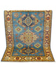 Tappeto Kazak celeste con cornice beige e motivi geometrici, annodato a mano in Afghanistan in lana e cotone con colori vegetali.