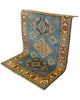 Tappeto Kazak celeste con cornice beige e motivi geometrici, annodato a mano in Afghanistan in lana e cotone con colori vegetali.