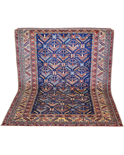 Tappeto Shirvan rettangolare 198x150 cm, fondo blu con cornice beige e motivo geometrico, annodato a mano in lana con colori vegetali, provenienza Afghanistan.