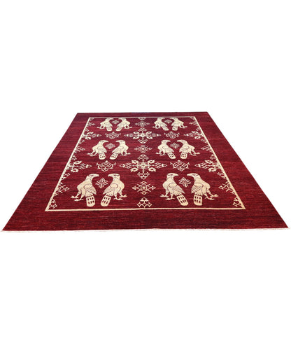 Tappeto 340x250 cm con uccelli avorio su fondo bordeaux per zona living di pregio.