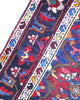 Tappeto Bakhtiyari annodato a mano, 214 x 149 cm, fondo rosso vinaccia con motivi decorativi raffinati.