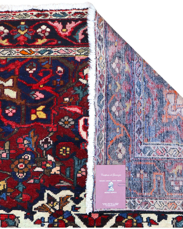 Tappeto Bakhtiyari annodato a mano, 214 x 149 cm, fondo rosso vinaccia con motivi decorativi raffinati.