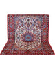 Tappeto Najafabad, annodato a mano, 219 x 152 cm, con motivi floreali decorativi in vari colori.