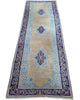 Passatoia Kerman persiana, fondo beige con motivi geometrici, annodato a mano, 297x74 cm.