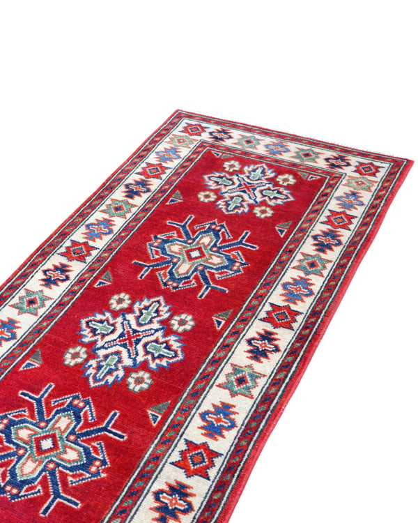 Passatoia Kazak annodata a mano (297x61 cm) in lana, con sfondo rosso melograno e bordo beige, con motivi geometrici afgani.

