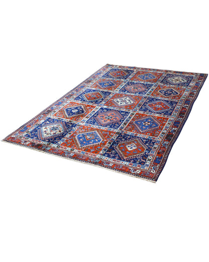 Tappeto Yalamhe persiano, fondo rosso mattone con motivi geometrici in blu, annodato a mano, 232x157 cm.