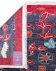 Tappeto moderno 233x180 cm Persia con fondo antracite, bordura rossa e motivi floreali stilizzati in rosso, avorio e azzurro, lana annodata a mano.