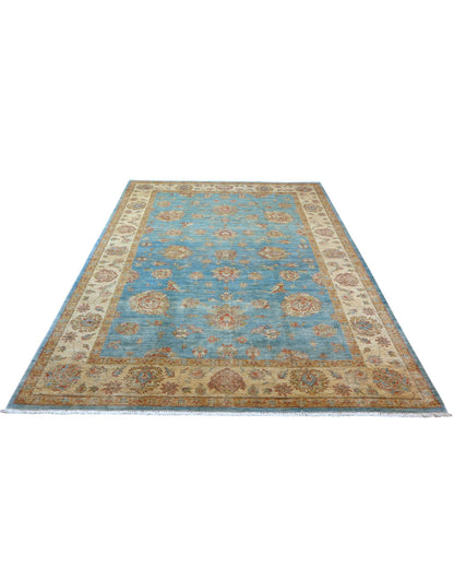 Tappeto Ziegler 298x200 cm con fondo azzurro, motivi floreali beige e oro e bordura chiara decorata, tramato ed annodato a mano, provenienza Afghanistan.