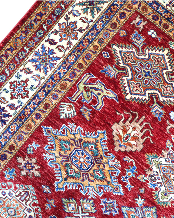 Tappeto Shirvan 295x207 cm con fondo bordeaux, motivi geometrici e floreali in avorio, blu e giallo, tramato ed annodato a mano, provenienza Caucaso.