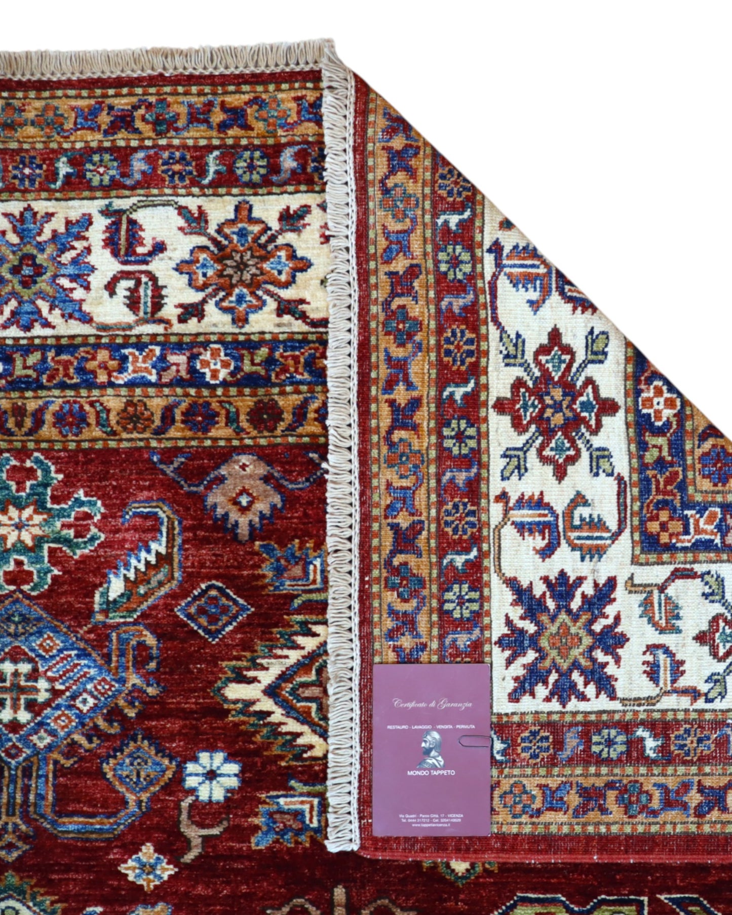 Tappeto Shirvan 295x207 cm con fondo bordeaux, motivi geometrici e floreali in avorio, blu e giallo, tramato ed annodato a mano, provenienza Caucaso.