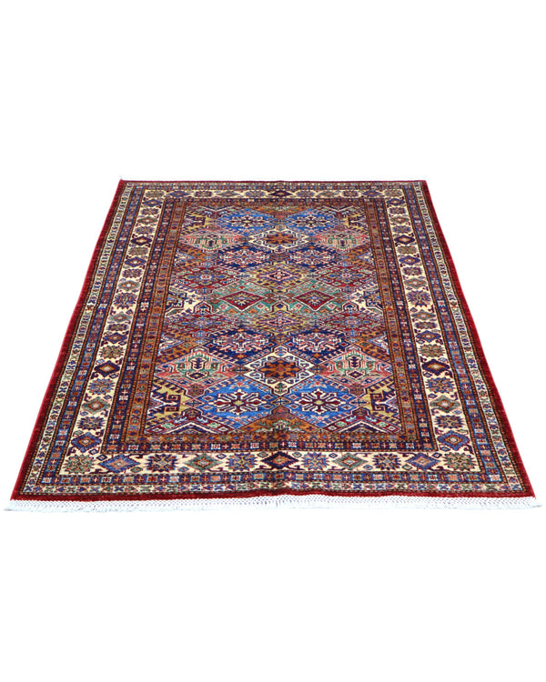 Tappeto Kazak 176x131 cm con motivi geometrici caucasici, colori blu, avorio e rosso, tramato ed annodato a mano.