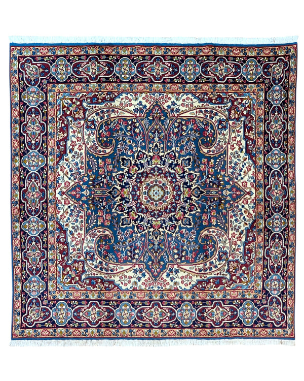 Tappeto Kirman 200x200 cm con motivo floreale centrale in blu, rosso e oro, bordura decorata, annodato a mano con lana pregiata e ordito in cotone.