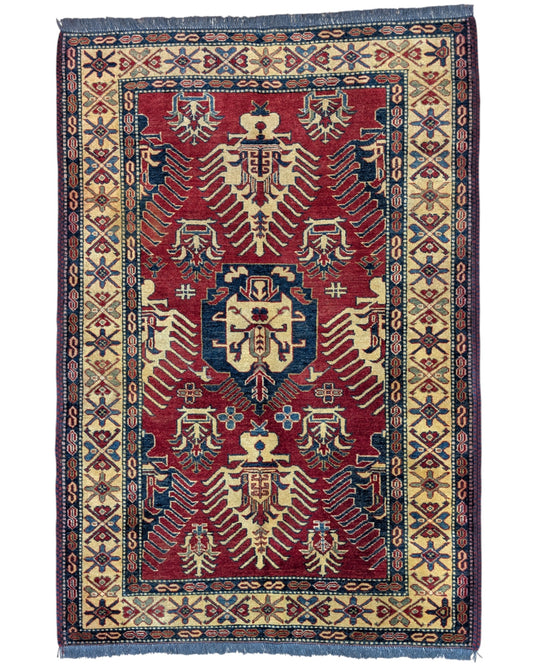 Tappeto Kazak rosso con cornice beige e motivi geometrici, annodato a mano in Afghanistan in lana e cotone con colori vegetali.