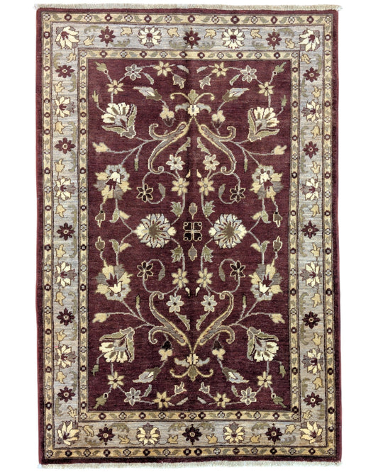 Tappeto Ziegler rosso mattone e beige, annodato a mano in Afghanistan. Realizzato in lana e cotone con colori vegetali, unisce raffinatezza floreale e tradizione artigianale.