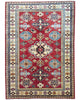 Tappeto Shirvan rosso con cornice beige e motivi geometrici, annodato a mano in Afghanistan in lana e cotone con colori vegetali.