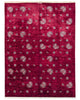 Tappeto moderno "Fiori e Foglie" con fondo rosso melograno e motivi beige di fiori e foglie stilizzati, annodato a mano in Persia.