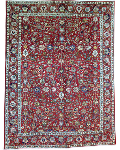 Tappeto Tabriz rosso con motivi floreali persiani, annodato a mano in Persia con lana e cotone tinti con colori vegetali.