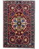 Tappeto Bakhtiyari rosso mattone con cornice blu e motivi decorativi, annodato a mano in Persia in lana e cotone tinti con colori vegetali.