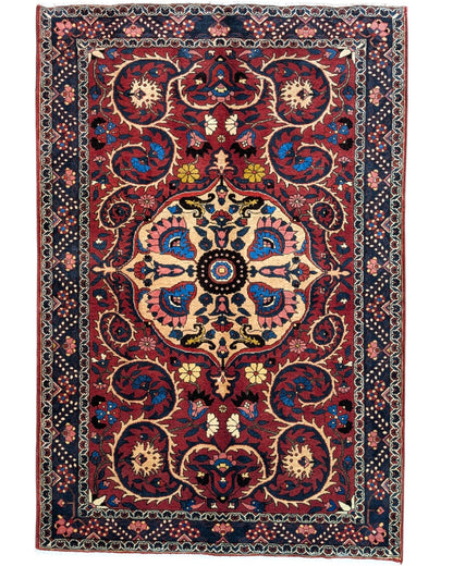 Tappeto Bakhtiyari rosso mattone con cornice blu e motivi decorativi, annodato a mano in Persia in lana e cotone tinti con colori vegetali.