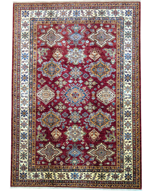 Tappeto Shirvan 295x207 cm con fondo bordeaux, motivi geometrici e floreali in avorio, blu e giallo, tramato ed annodato a mano, provenienza Caucaso.