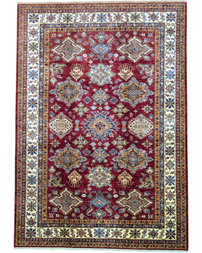 Tappeto Shirvan 295x207 cm con fondo bordeaux, motivi geometrici e floreali in avorio, blu e giallo, tramato ed annodato a mano, provenienza Caucaso.