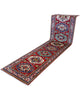 Passatoia Kazak afgana 351x91 cm annodata a mano in lana, con un design audace caratterizzato da motivi geometrici su un fondo rosso intenso.