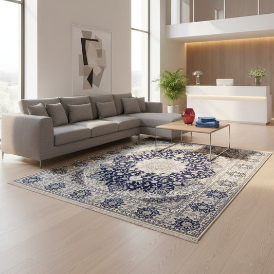 Tappeto persiano Nain 390x297 cm, fondo blu notte con medaglione centrale e motivi floreali avorio e azzurro, annodato a mano in lana vegetale.