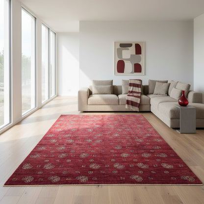 Tappeto Moderno 349x248 cm annodato a mano, rettangolare, fondo rosso con motivi decorativi stilizzati, realizzato in cotone e lana con colori vegetali.