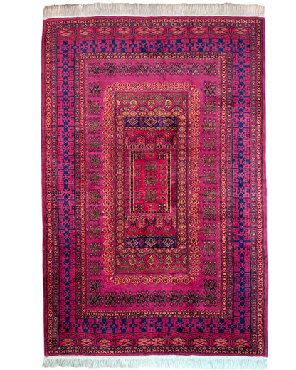 Tappeto Turkemen 278x185 cm con motivo geometrico ricco di rosa, blu e giallo, annodato a mano con lana di alta qualità e ordito in cotone resistente.