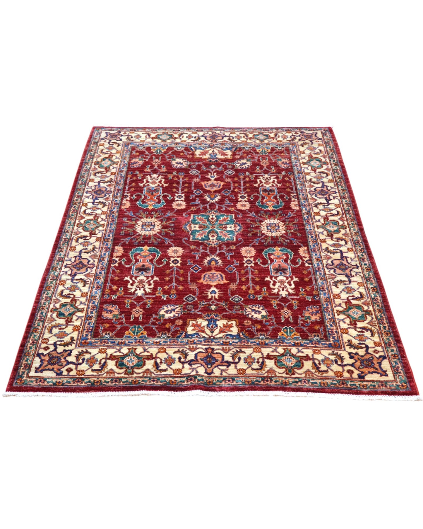 Tappeto Farahan 176x127 cm con motivi floreali e geometrici in rosso, blu, verde e oro su fondo beige.