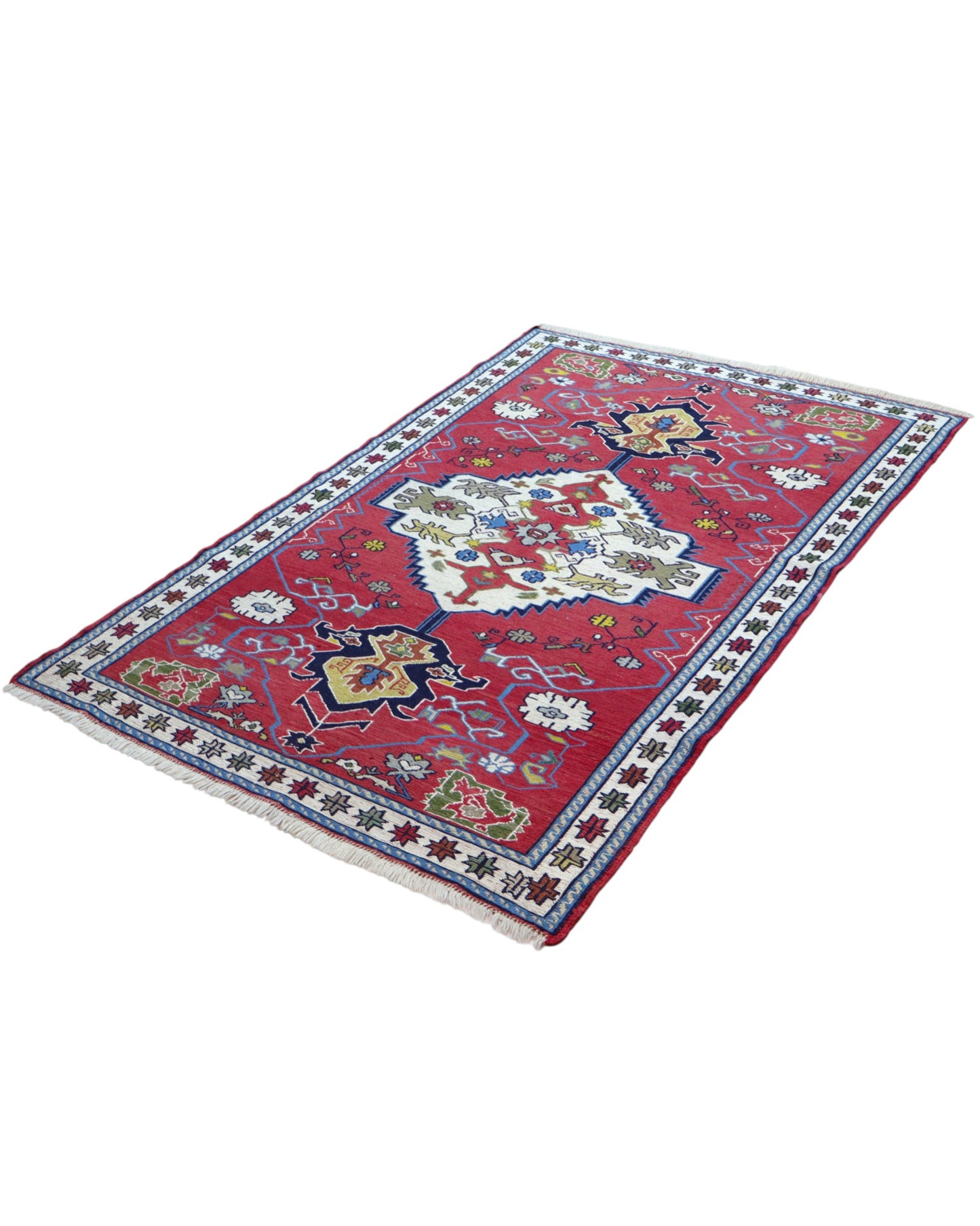 Tappeto Kilim 190x122 cm con motivi geometrici in rosso, blu, giallo e verde su fondo beige.